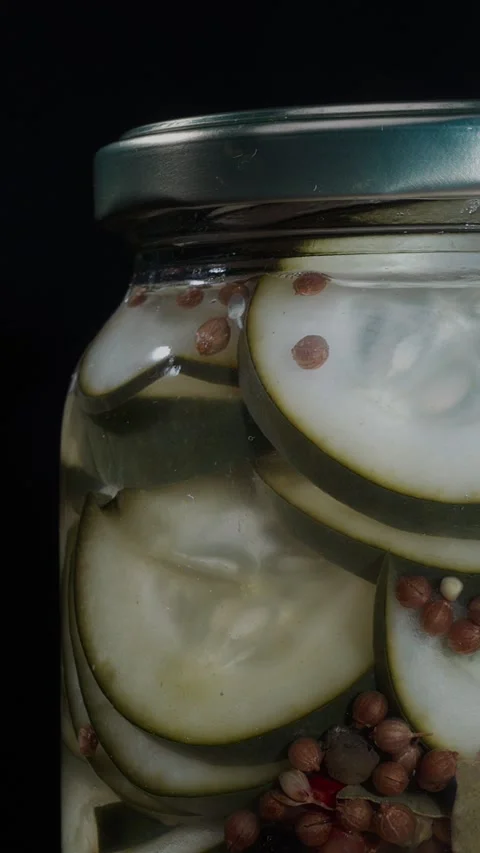 Vertical Spinning Pickled Cucumber Jar Close Up Texture Showcase Stock Footage 324922587
