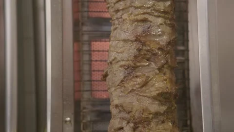 Vertical Spit of Grilled Meat Rotating in Restaurant Kitchen, Sydney Australia Stock Footage 345808850