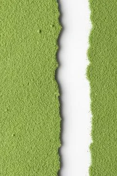 Vertical split of vibrant green matcha powder with central white gap, texture Stock Photos