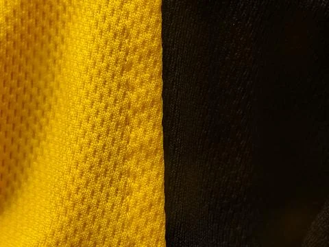 A vertical split-view showing two distinct fabric textures: porous yellow m.. Stock Photos
