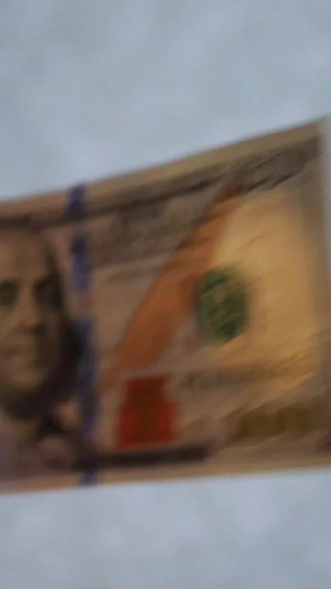 Vertical. A stack of crisp, dollar bills, held in capable hands. Stock Footage 304631418