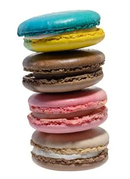 A vertical stack of four colorful macarons blue, yellow, brown, and pink. 写真素材