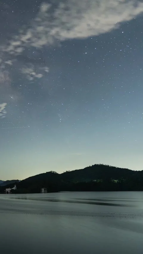Vertical Starry Night Lake Timelapse with Milky Way Reflection and Calm Water Stock Footage 327478807
