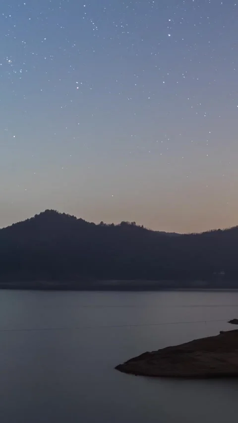 Vertical Starry Night Lake Timelapse with Milky Way Reflection and Calm Water Stock Footage 327478845