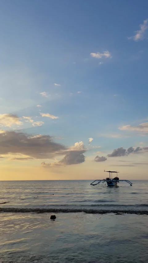 Vertical Static Shot of Traditional Boat on Bali Sea at Sunset Stock Footage 339276599