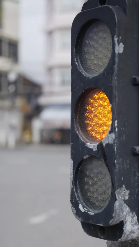A vertical static view captures a traffic light transitioning between signals Stock Footage 324889783