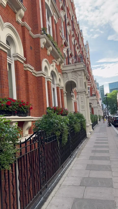 Vertical static view of traditional London brick houses and street pavement Stock Footage 337324195