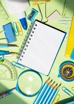 Vertical Stationery Flat Lay with Notebook on Colorful Background Stock Photos