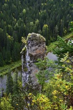 Vertical stone pillar Devil's Finger with a negative slope of surfaces as par Stock Photos