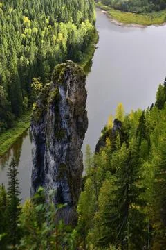 Vertical stone pillar Devil's Finger with a negative slope of surfaces as par Stock Photos