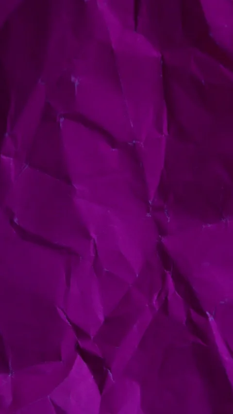 Vertical stop-motion animation of dark pink wrinkled paper. Seamless loop for Stock Footage 335894902