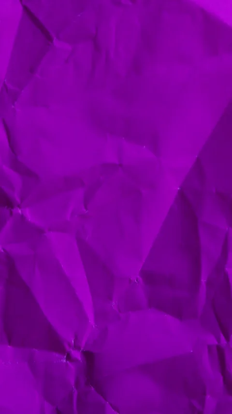 Vertical stop-motion animation of purple wrinkled paper. Seamless loop for co 動画素材 335894893