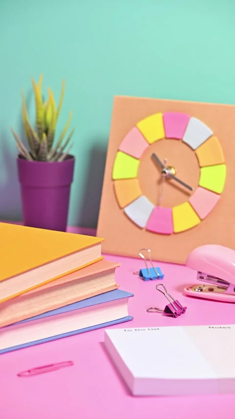 Vertical Stop Motion of Playfully Arriving School Stationery on Pastel Canvas Stock Footage 258668113