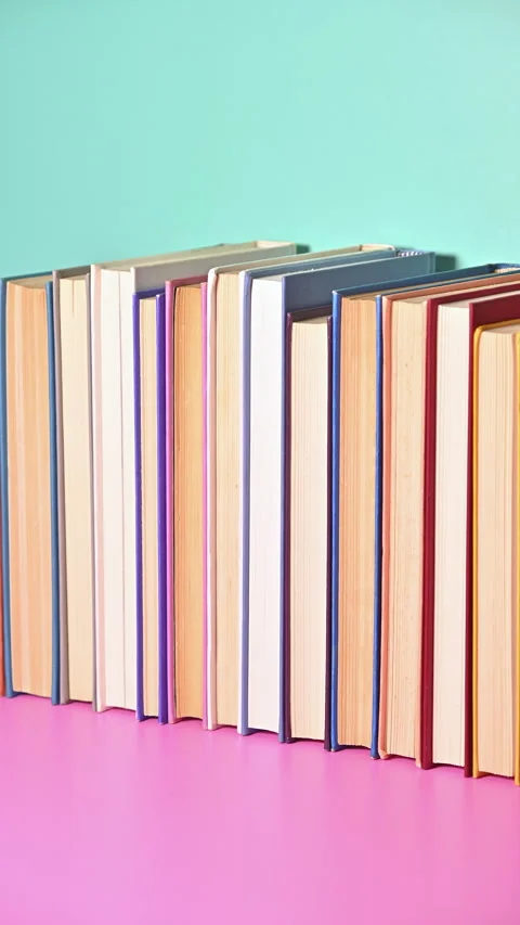 Vertical Stop Motion of Playfully Ordering Books on Pastel Shelves 스톡 동영상 258597369