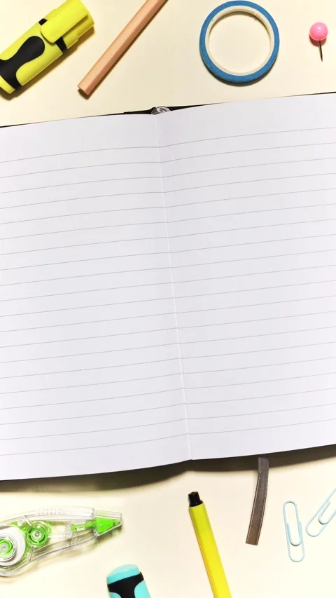 Vertical Stop Motion School Supplies Framing Open Notebook Stock Footage 315491000
