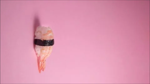 Vertical stop motion of sushi appearing on top of each other. Stock Footage