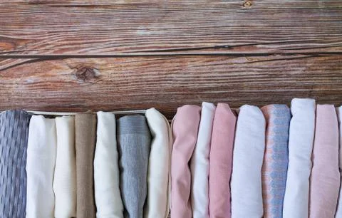 Vertical storage of clothing. Organizer wardrobe boxes with clothes top view Stock Photos