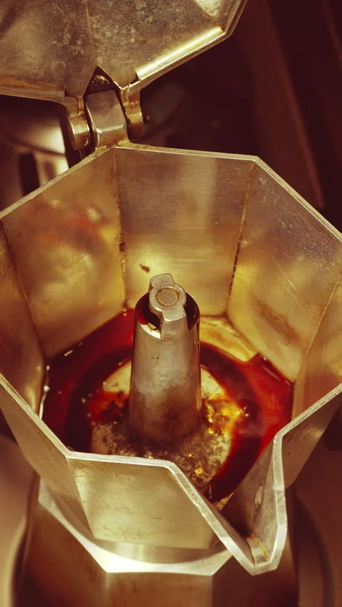 Vertical – A stove top coffee pot, starting to fill as it brews. Stock Footage 283395668