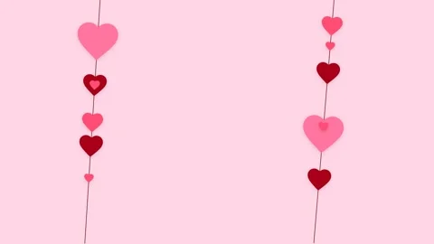 Vertical strings of hanging pink and red hearts on a soft pink background. Video stock 341775341