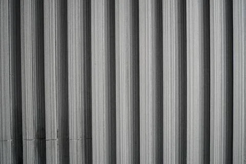 Vertical Striped Pattern of Grey and Black Textured Surface with Subtle Linear Foto stock