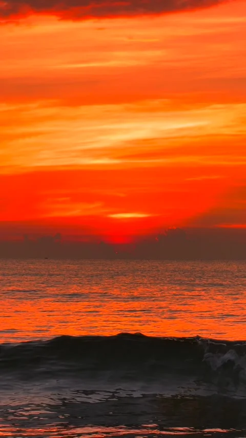 Vertical Stunning Romantic Sunrise Over sea Waves and Distant Mountains Video stock 343595068