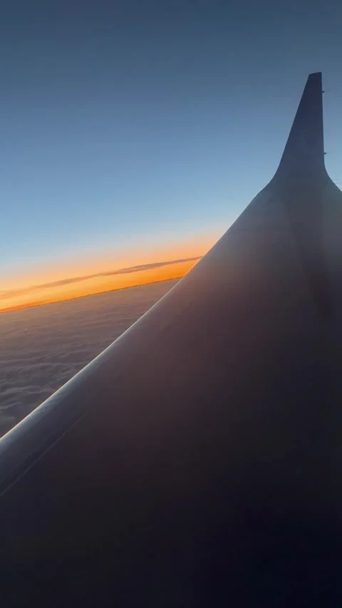 Vertical Sunrise Flight View Through Airplane Window. Video stock 335999775