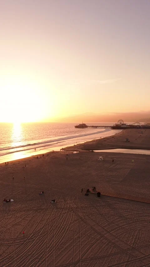 Vertical Sunset Drone Flight Over Santa Monica Beach Toward Pier Stock Footage 333283279