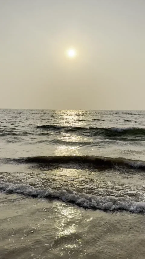 Vertical sunset over Arabian Sea waves at Calangute Beach Goa India Vídeo Stock 343150133