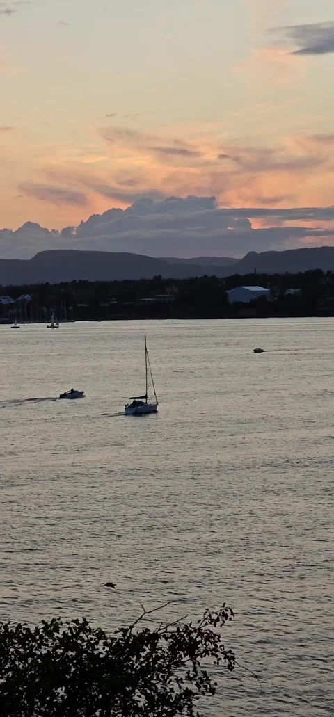 Vertical - Sunset over Oslofjord with Boating Traffic and Mountain Ridge, Norway Stock Footage 346653081