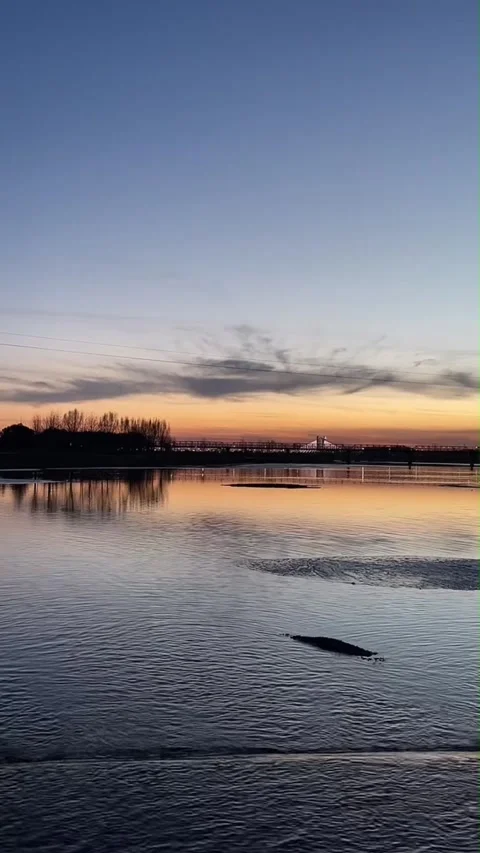 Vertical Sunset Over Urban River in China with Bridge and City Silhouettes Video stock 333285454