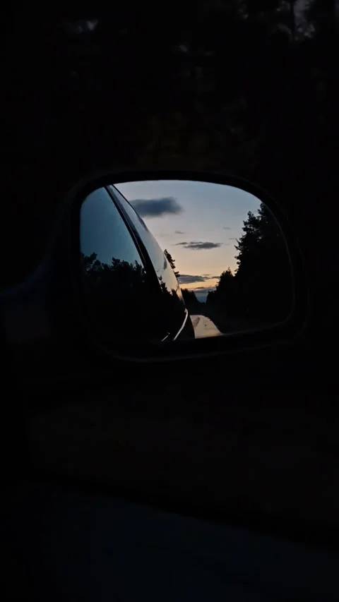 Vertical. Sunset rearview road. Driving a car on a highway at dusk Stock Footage 319998825
