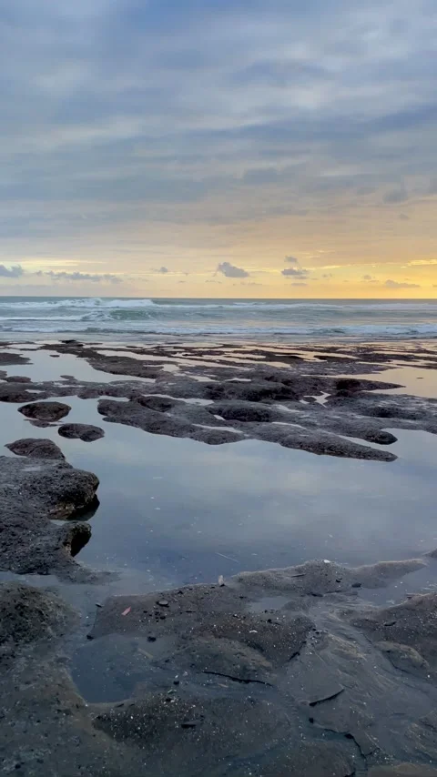 Vertical Sunset Tidal Pools and Volcanic Rocks Beach in Bali Stock Footage 337270077
