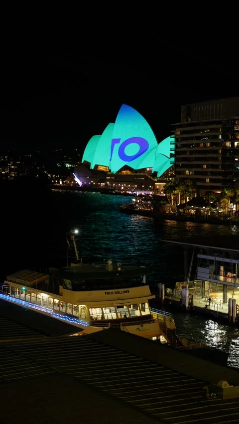 Vertical Sydney Opera House and ferry wharf during VIVID 6K Stock Footage 310377157