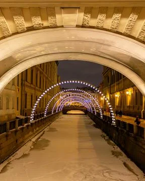Vertical symmetrical view of Hermitage Bridge over Winter Canal Stock Photos