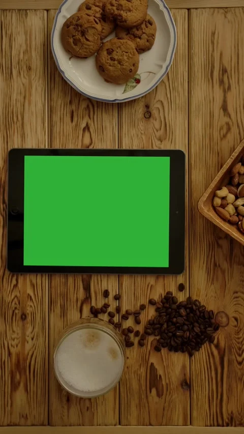 Vertical of Tablet near biscuits and cappuccino Stock Footage 276922696