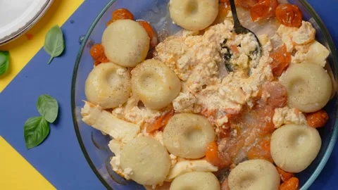 Vertical tabletop video: chef adds spices to the plate with potato dumpling with Stock Footage 181851024