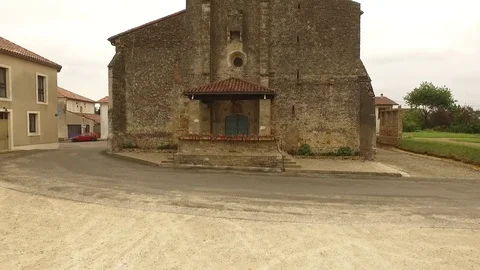 Vertical take-off in front of an old church Stock Footage 70989319