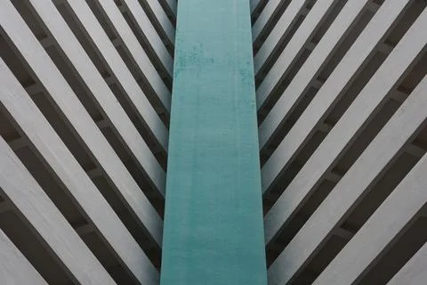Vertical teal panel contrasts with diagonal concrete stripes Stock Photos