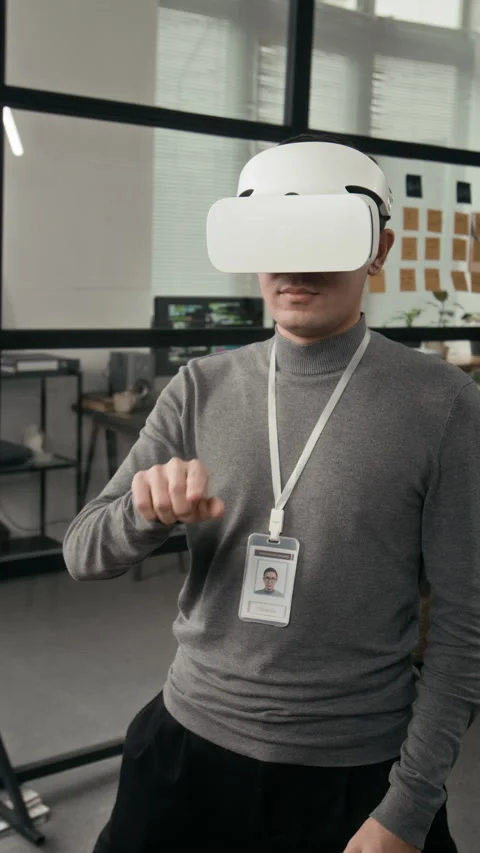 Vertical of Tech Specialist Wearing VR Headset Creating Interactive Environment Stock Footage 329612824