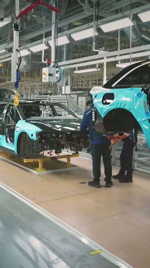 Vertical Technicians Installing Interior Components On Electric Vehicle Asse Stock-Footage 332958468