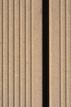Vertical texture of grooved composite decking board with gap 스톡 사진