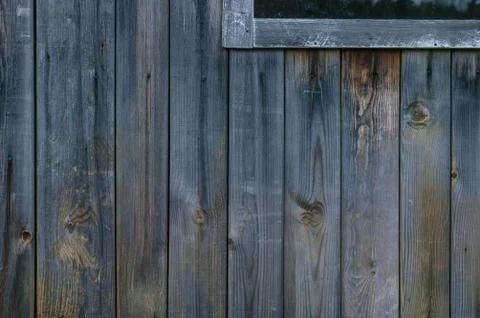 Vertical texture house wall of the old wooden boards. Rustic background Stock Photos