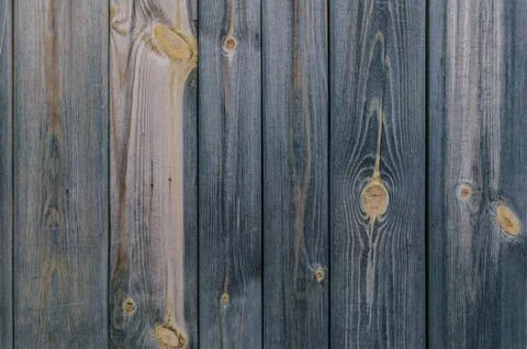 Vertical texture house wall of the old wooden boards. Rustic background Stock Photos
