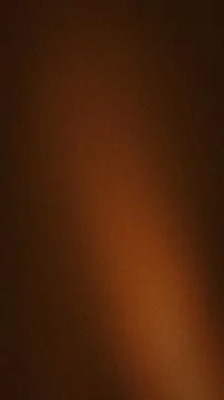 Vertical textured gradient background with brown orange and black tones gra.. Stock Photos