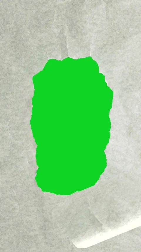 Vertical textured parchment small torn hole break revealing animated on green 库存影片 335216856