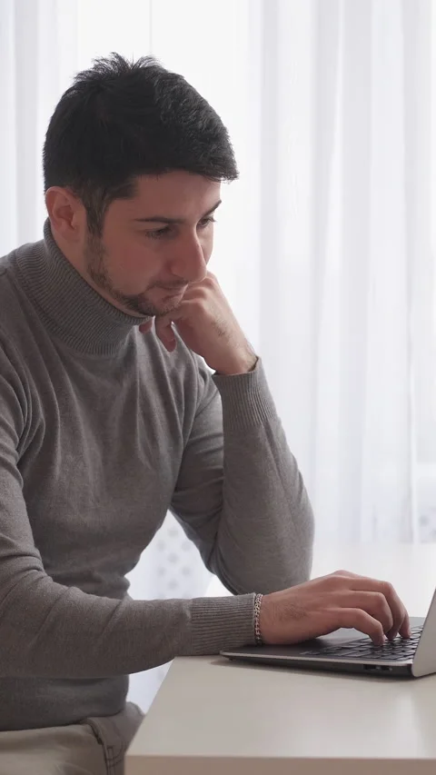 Vertical thoughtful developer remore man laptop Stock Footage 246718527