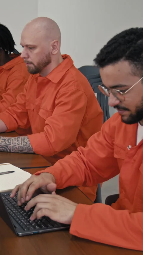 Vertical of Three Diverse Inmates Working on Laptops during Coding Lesson 스톡 동영상 314056658