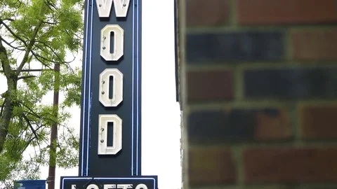 Vertical tilt of Hollywood sign at store in downtown Seattle Stock Footage 73494584