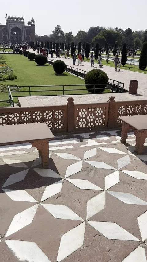 Vertical tilt up view of Great Gate Darwaza i Rauza Taj Mahal gardens Agra India 動画素材 343134312