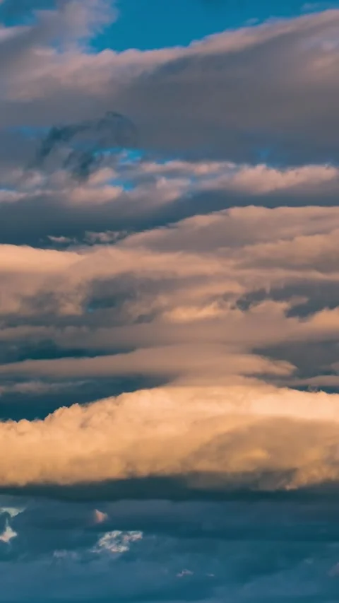 Vertical time lapse of clouds sky motion fast in evening nature background Video stock 295851199